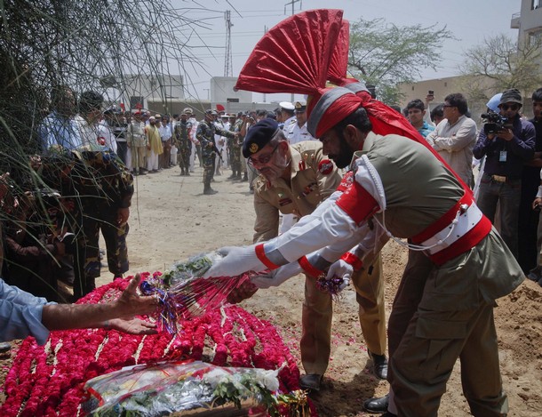 Laying wreath on grave of victim of Karachi base attack, May 2011